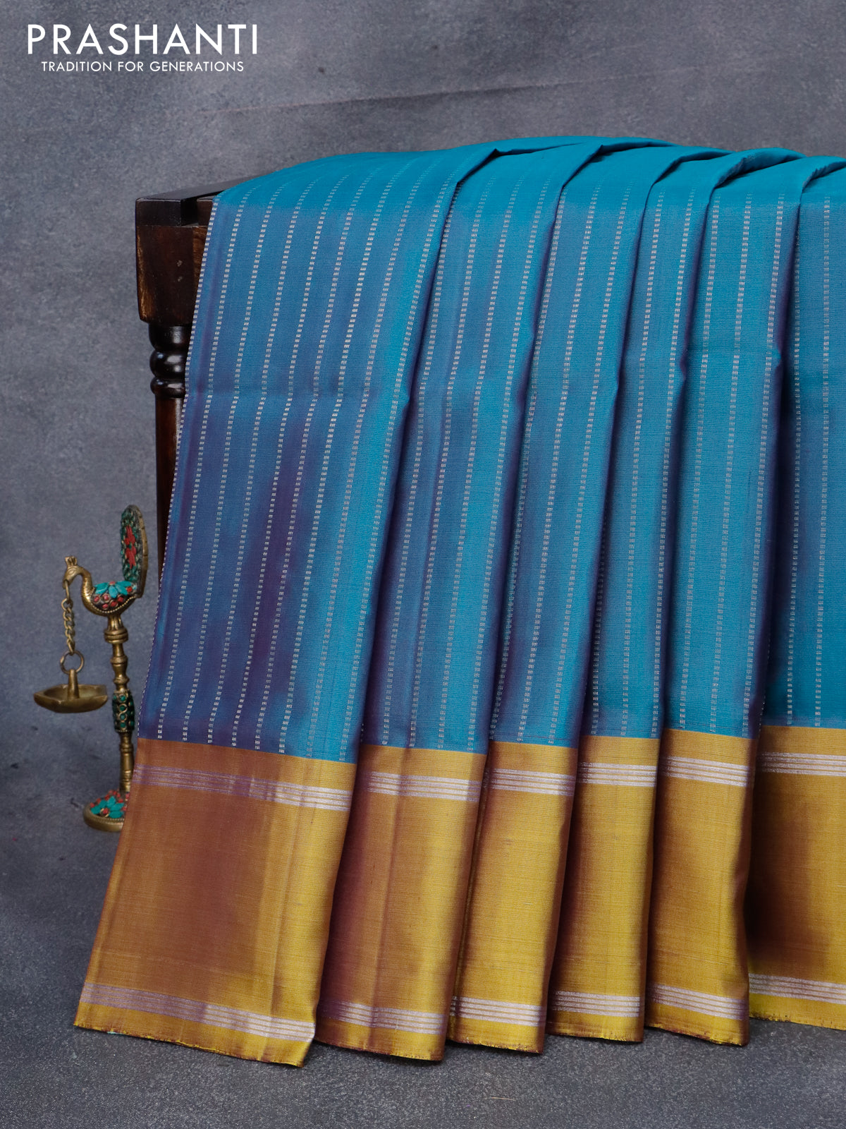 Lite teal blue silk saree in silver stripes, contrast double korvai border  & pallu intricately designed in silver zari