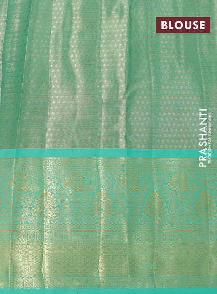 Tissue semi kanjivaram silk saree dual shade of red and teal green with allover thread & zari woven floral brocade weaves and long floral zari woven border