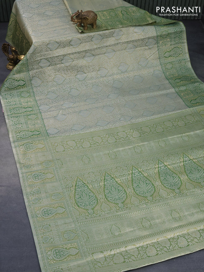 Tissue semi kanjivaram silk saree pastel green and green with allover silver zari woven broacde weaves and silver zari woven border