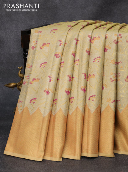 Tissue semi kanjivaram silk saree pale yellow with allover zari woven brocade weaves and temple design zari woven border