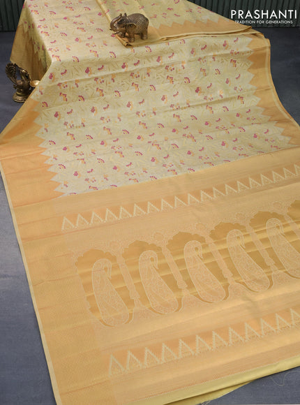 Tissue semi kanjivaram silk saree pale yellow with allover zari woven brocade weaves and temple design zari woven border