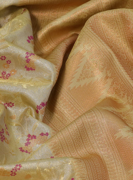 Tissue semi kanjivaram silk saree pale yellow with allover zari woven brocade weaves and temple design zari woven border