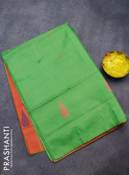 Banana pith saree green and dual shade of rust with thread woven buttas in borderless style