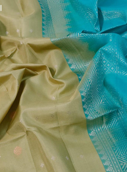 Pure soft silk saree elaichi green shade and teal blue with allover silver & copper zari buttas and simple border