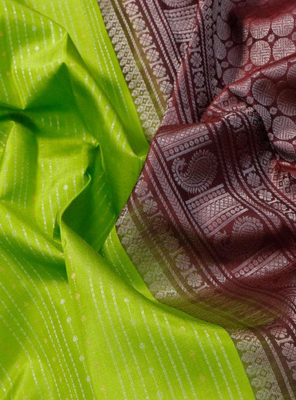 Pure soft silk saree light green and deep maroon with allover silver & copper zari weaves and long silver & copper zari woven butta border