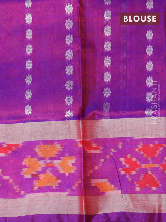 Pure uppada silk saree dual shade of greenish maroon and dual shade of purple with allover silver zari woven floral buttas and silver zari woven ikat style border