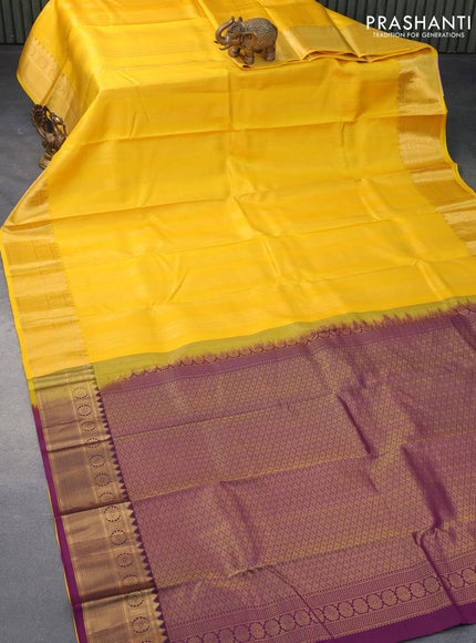 Pure kanjivaram silk saree yellow and deep purple with allover zari weaves and zari woven border