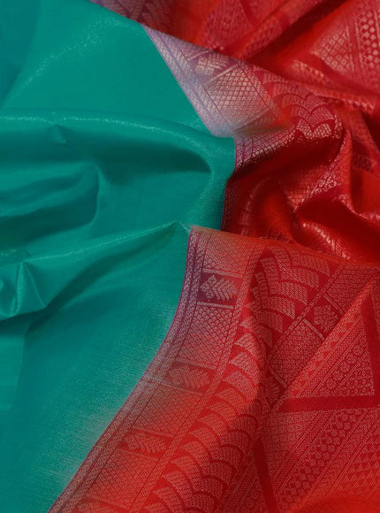 Pure kanjivaram silk saree teal blue and dual shade of pinkish orange with zari woven geometric buttas in borderless style