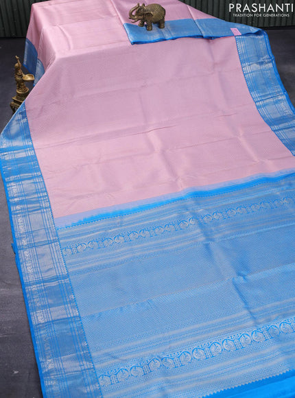 Pure kanjivaram silk saree light pink and cs blue with allover silver zari woven brocade weaves and silver zari woven border