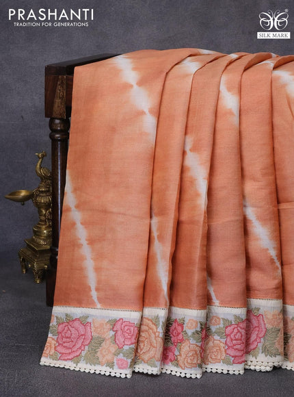 Pure tussar silk saree peach orange and cream with tie & dye prints and floral design embroidery work border