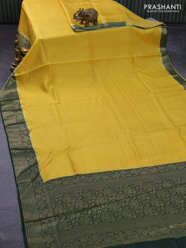 Dola silk saree yellow and bottle green with allover zari stripe weaves and zari woven border & zari butta blouse