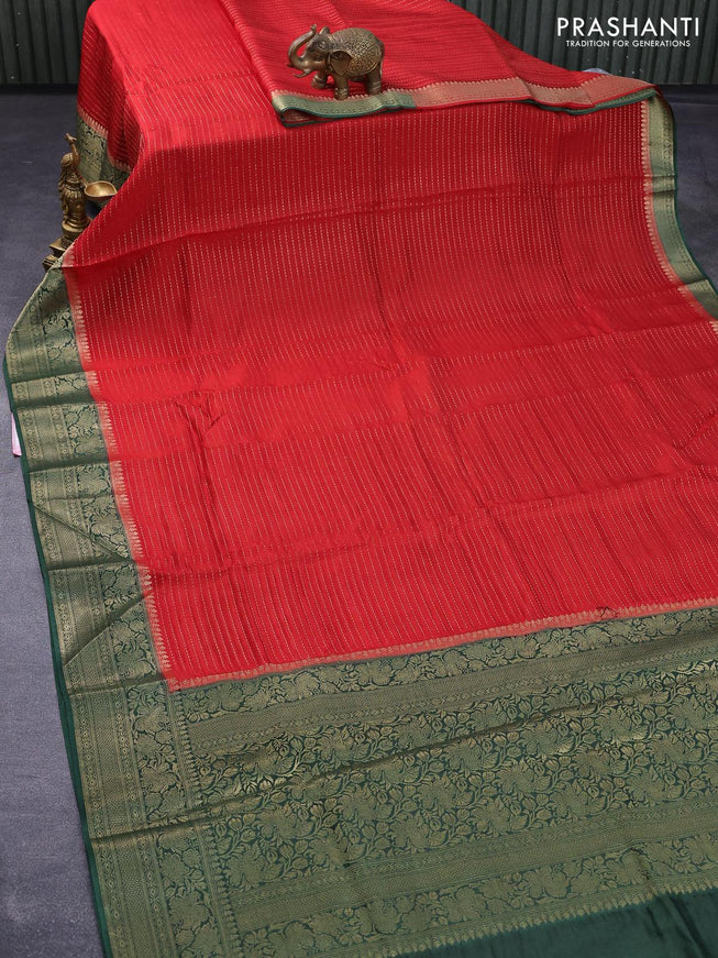 Dola silk saree red and bottle green with allover zari stripe weaves and zari woven border & zari butta blouse