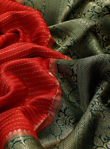 Dola silk saree red and bottle green with allover zari stripe weaves and zari woven border & zari butta blouse