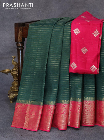 Dola silk saree bottle green and pink with allover zari stripe weaves and zari woven border & zari butta blouse