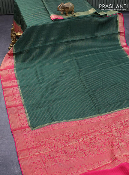 Dola silk saree bottle green and pink with allover zari stripe weaves and zari woven border & zari butta blouse