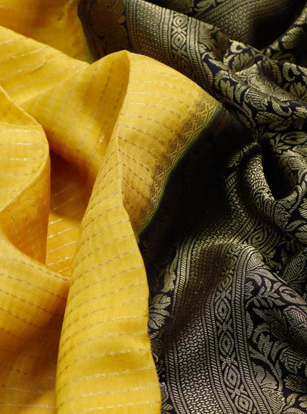 Dola silk saree yellow and bottle green with allover zari stripe weaves and zari woven border & zari butta blouse