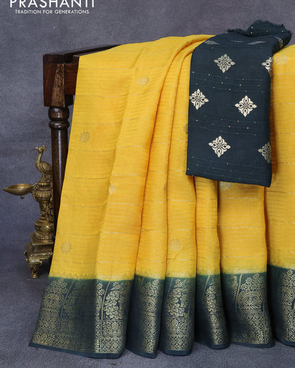 Dola silk saree yellow and dark green with allover zari stripes & butta weaves and zari woven border & zari butta blouse