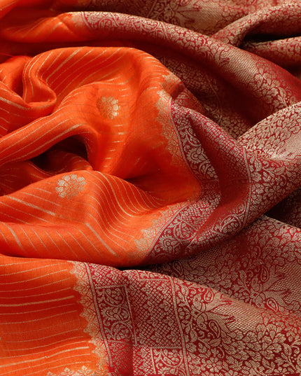 Dola silk saree orange and red with allover zari stripes & butta weaves and zari woven border & zari butta blouse