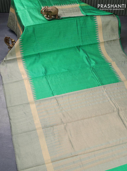 Dupion silk saree green and green shade with plain body and temple design zari woven simple border