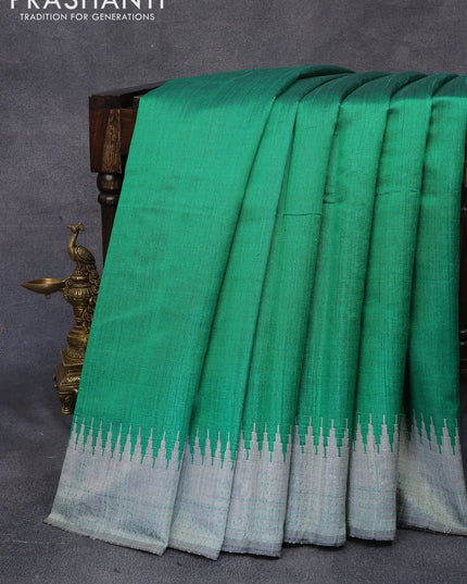 Dupion silk saree green and grey with plain body and temple design thread woven border