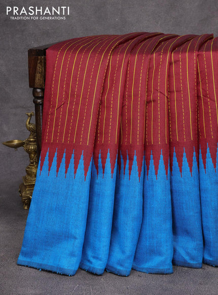 Dupion silk saree maroon and cs blue with allover thread weaves and temple design woven border