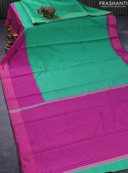 Dupion silk saree green and magenta pink with plain body and temple design thread woven zari border