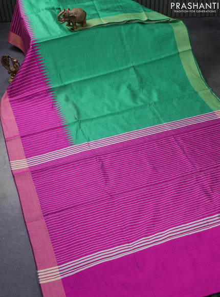 Dupion silk saree green and magenta pink with plain body and temple design thread woven zari border