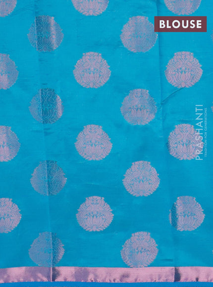 Semi raw silk saree cs blue with allover pink zari woven buttas and small pink zari woven border