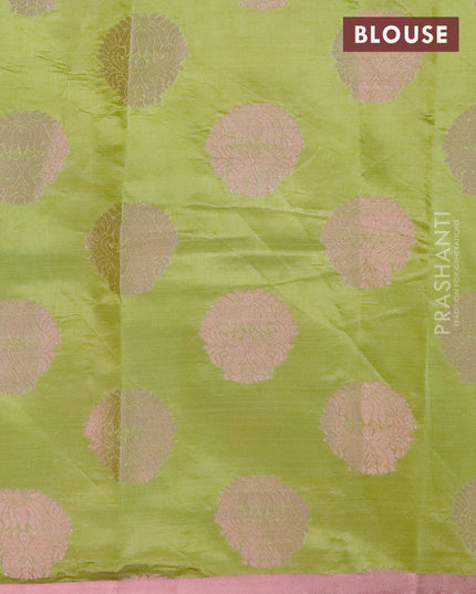 Semi raw silk saree light green with allover pink zari woven buttas and small pink zari woven border