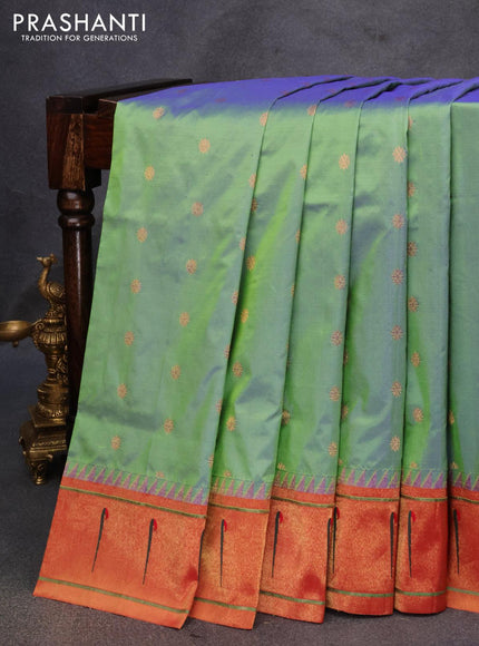 Pure paithani silk saree dual shade of bluish green and red with allover zari woven floral buttas and zari woven paithani butta border