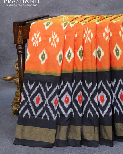 Pochampally silk saree orange and black with allover ikat butta weaves and ikat design zari woven border