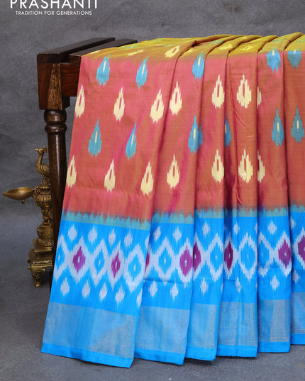 Pochampally silk saree dual shade of greenish pink and cs blue with allover ikat woven butta weaves and ikat style zari woven border