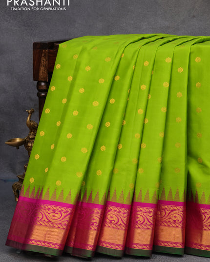 Pure gadwal silk saree lime green and magenta pink with zari woven buttas and temple design zari woven border