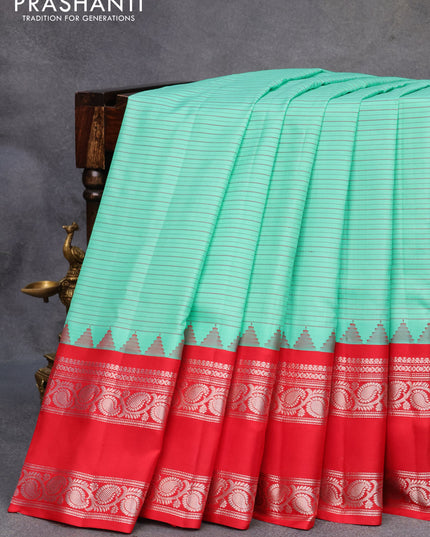 Pure gadwal silk saree teal green and red with allover stripes pattern and rettapet silver zari woven border