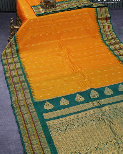 Pure gadwal silk saree orange and green with zari woven paisley buttas and temple design zari woven border