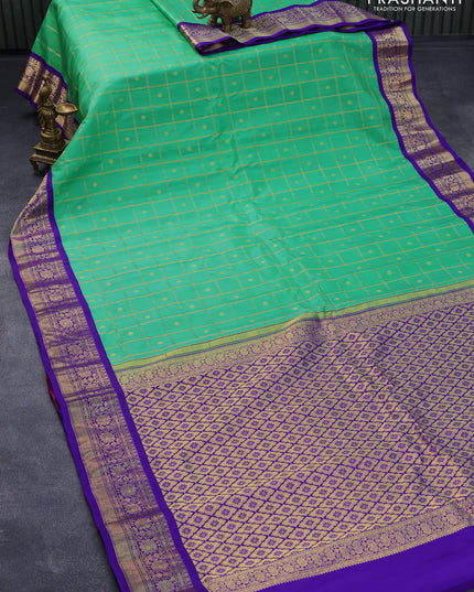 Pure gadwal silk saree light green and violet with allover zari checks & buttas and zari woven border