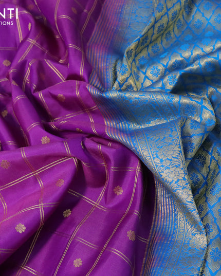 Pure gadwal silk saree purple and cs blue with allover zari checks & buttas and zari woven border