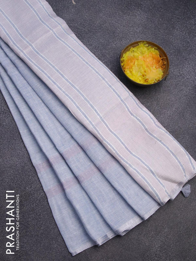 Pure linen saree greyish blue with plain body and silver zari woven piping border