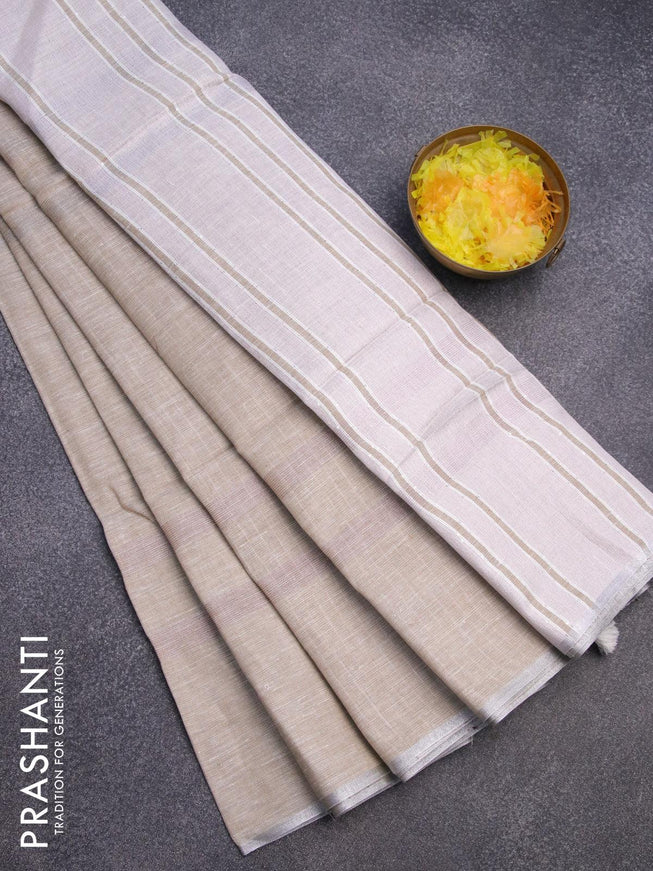 Pure linen saree beige with plain body and silver zari woven piping border