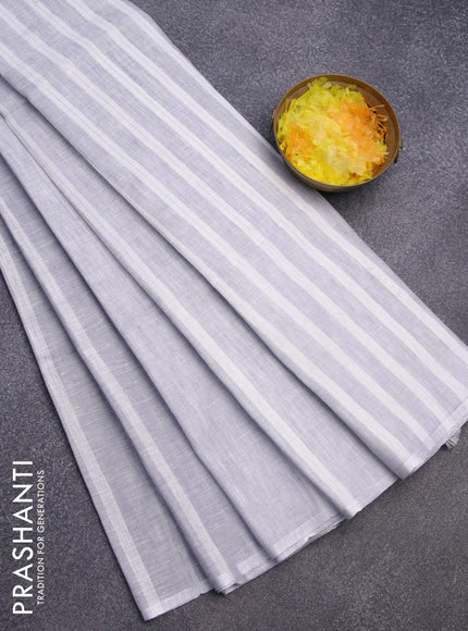 Pure linen saree grey and off white with silver zari stripe pattern and silver zari woven piping border