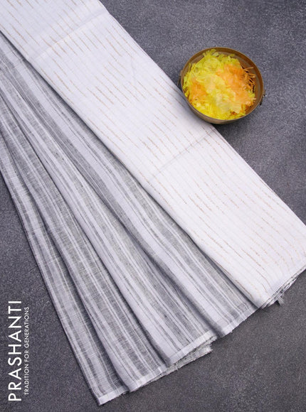 Pure linen saree black and off white with allover stripe pattern and silver zari woven piping border