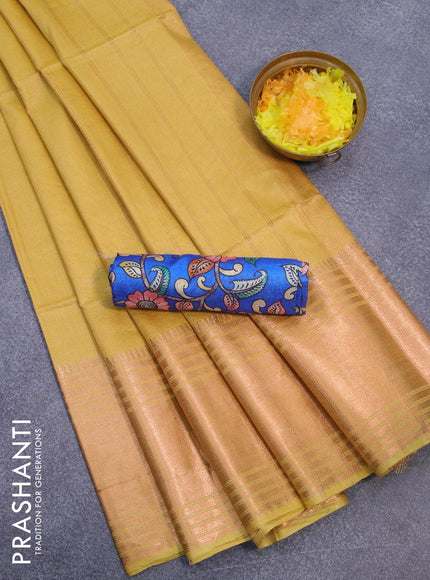 Semi tussar saree lime yellow and royal blue with plain body and copper zari woven border & kalamkari printed blouse