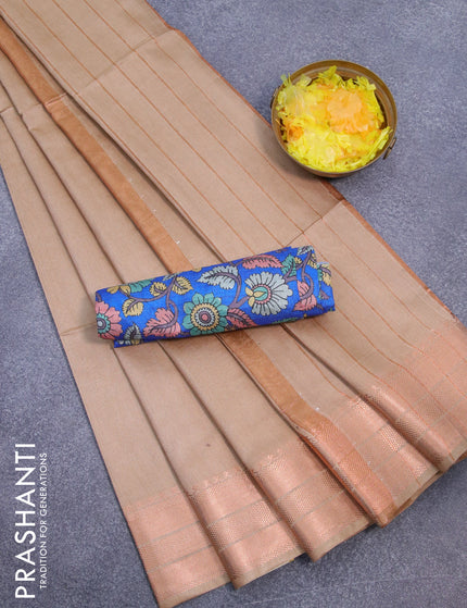 Semi tussar saree beige and blue with plain body and copper zari woven border & kalamkari printed blouse