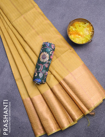 Semi tussar saree yellow and dark green with plain body and copper zari woven border & kalamkari printed blouse