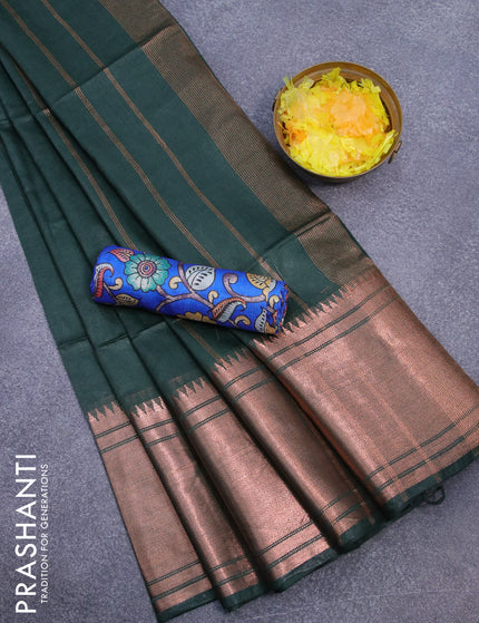 Semi tussar saree bottle green and blue with plain body and long copper zari woven border & kalamkari printed blouse