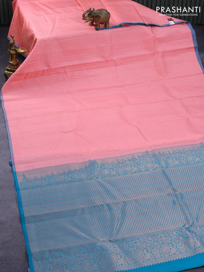 Pure kanjivaram silk saree peach pink and teal blue with allover zari weaves and piping border