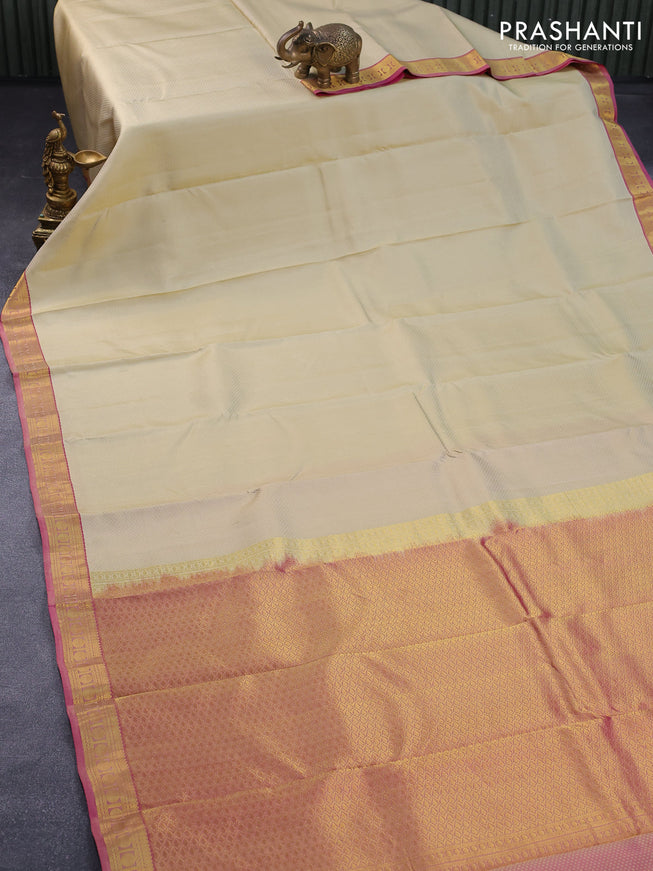 Pure kanjivaram silk saree sandal and pink with allover self emboss and zari woven border