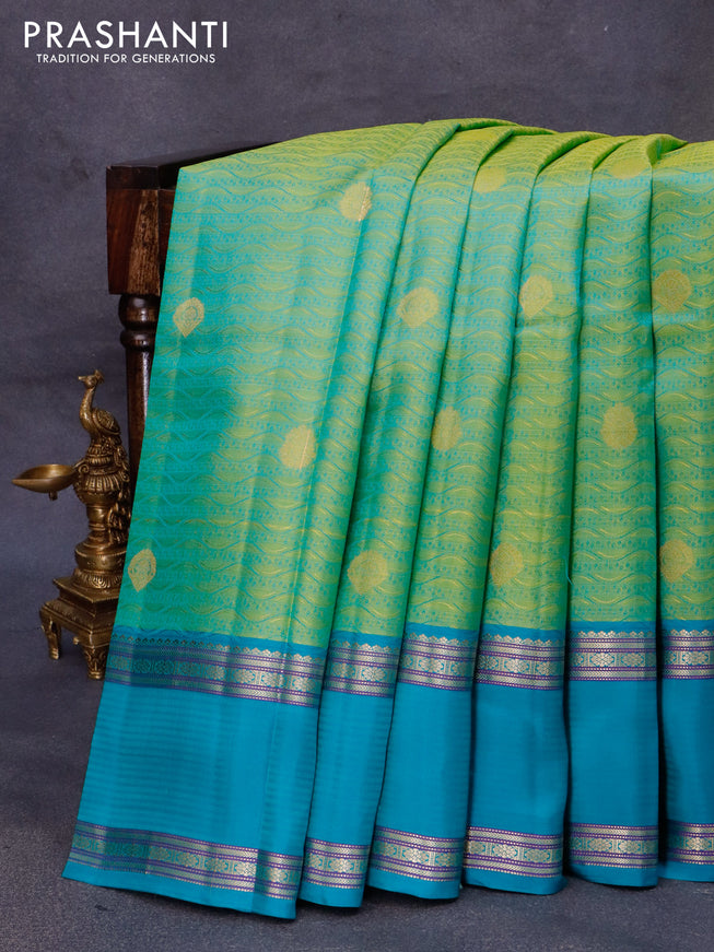 Pure kanjivaram silk saree yellowish green and teal blue with allover self emboss & buttas and rettapet zari woven border
