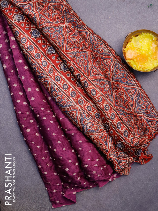 Modal silk saree purple shade and maroon with allover bandhani prints and ajrakh printed pallu