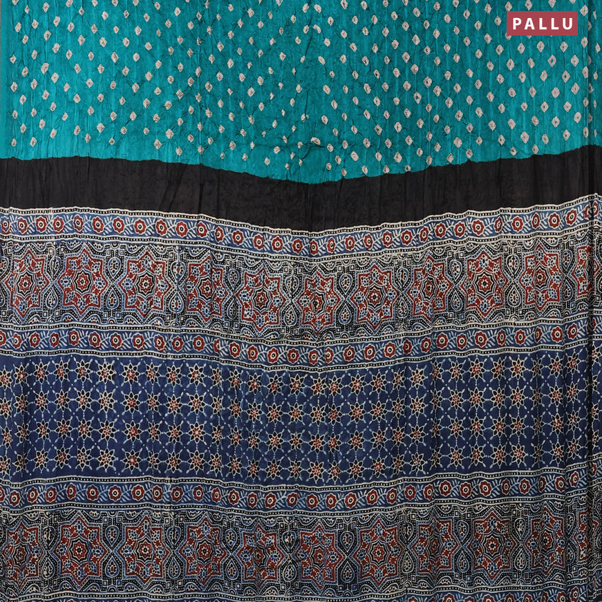 Modal silk saree teal green and blue with allover bandhani prints and ajrakh printed pallu